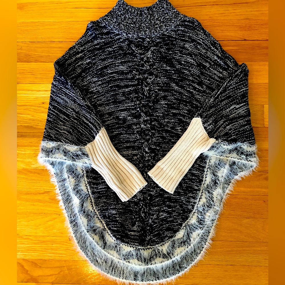 Girls Black/Cream Tweed Cape with Sleeves. And decorative trim accents.
